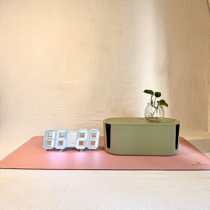 Digital clock, green Cable Management box and Blush Pink desk mat with a neutral background
